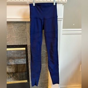 Lululemon leggings. Navy blue with mesh zig zags down legs. Size 4.
